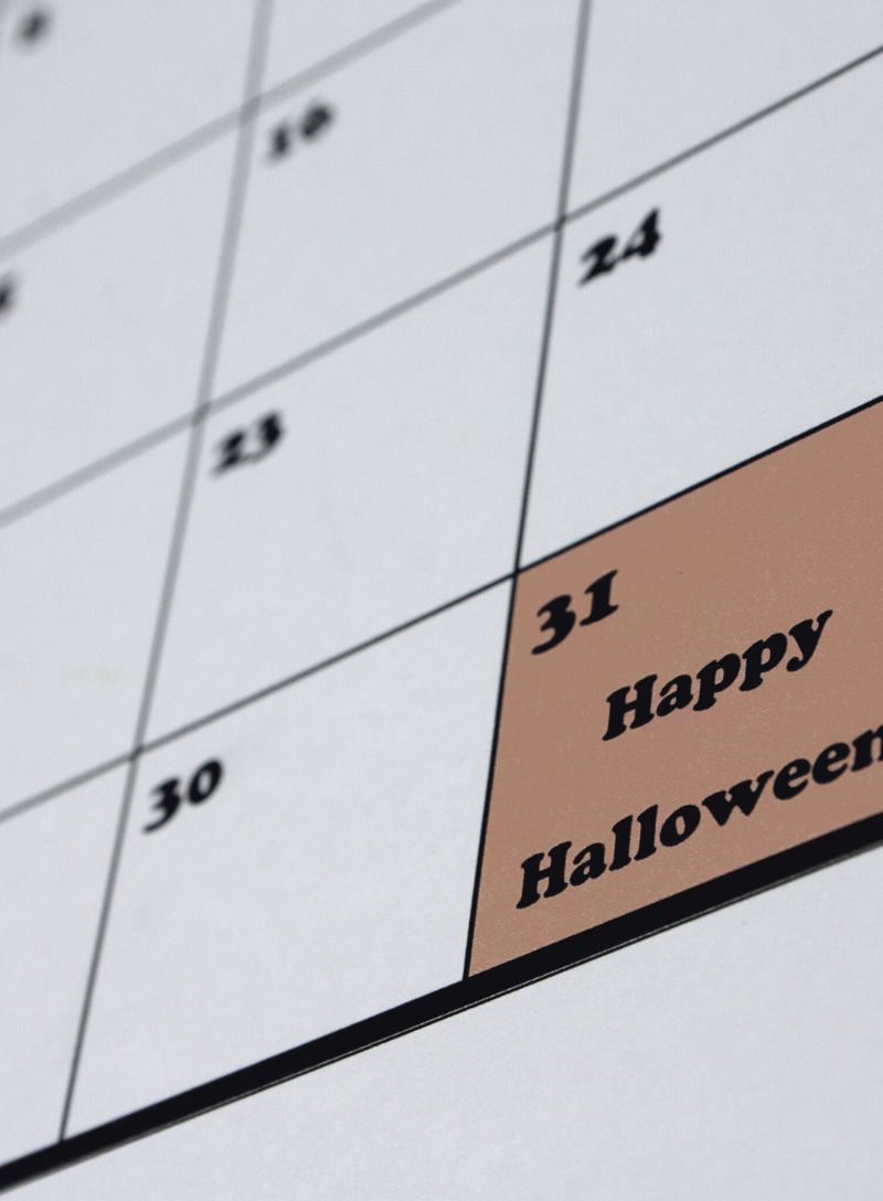 Ripped news articles showing tariffs, oil, concert