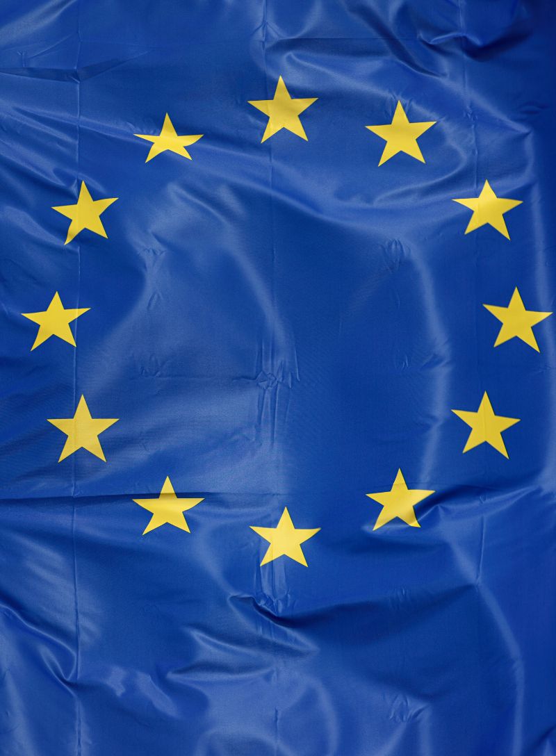 Ripped news articles showing tariffs, oil, concert