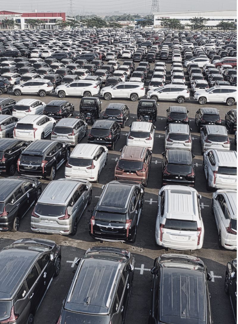 Ripped news articles showing tariffs, oil, concert