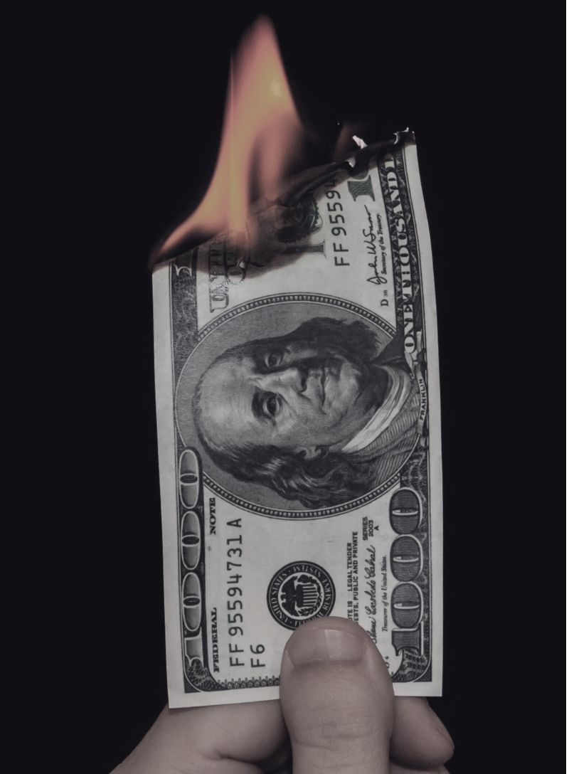 Ripped news articles showing tariffs, oil, concert